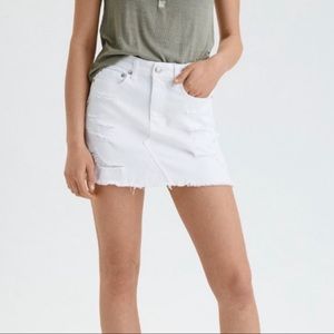 Distressed white denim skirt